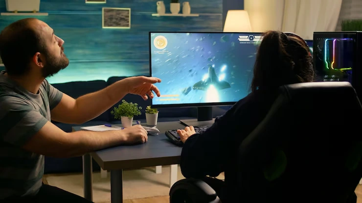 Developer team discussing gameplay at a Custom Game Development Agency in UK