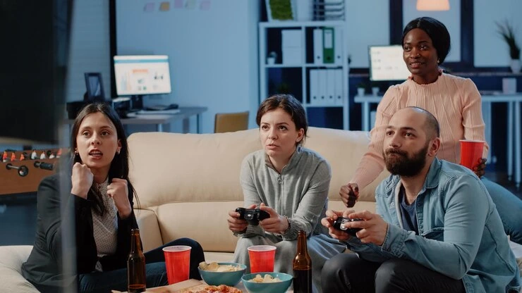 Team enjoying a game session at a Multiplayer Game Development Agency in UK